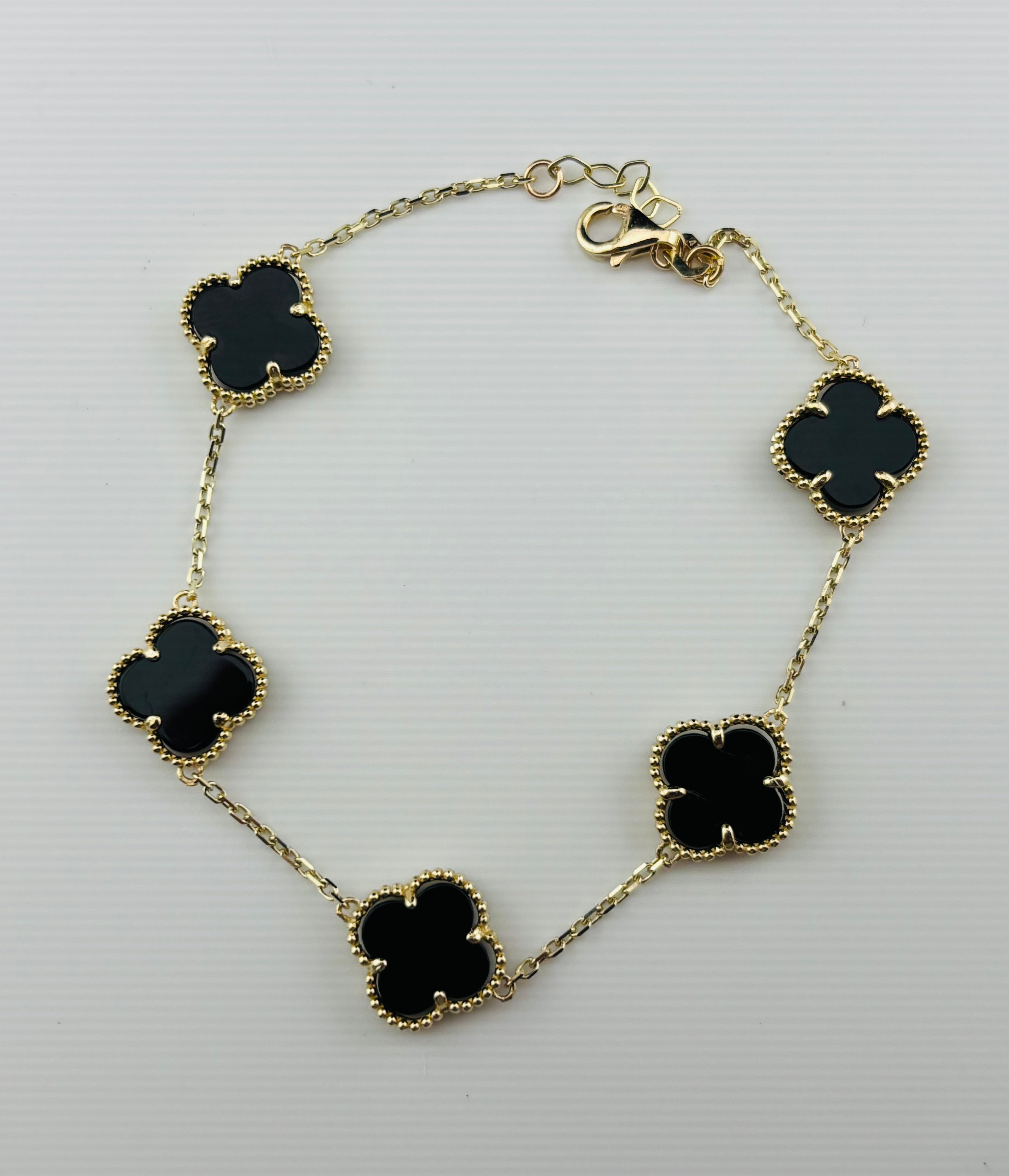 Pulseras Clover negras en oro 10K